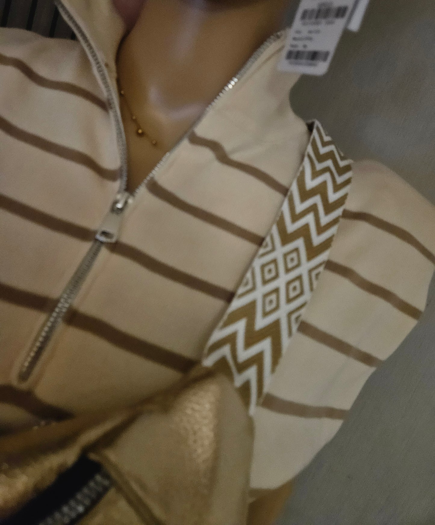 Pull sans manche rayé avec fermeture
